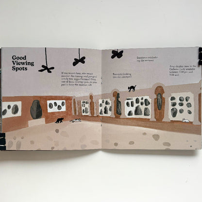 Open book with illustrations and text on a white background